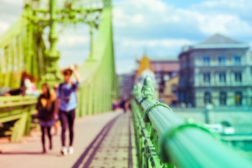 Liberty bridge in Budapest, Hungary with people walking on it. D